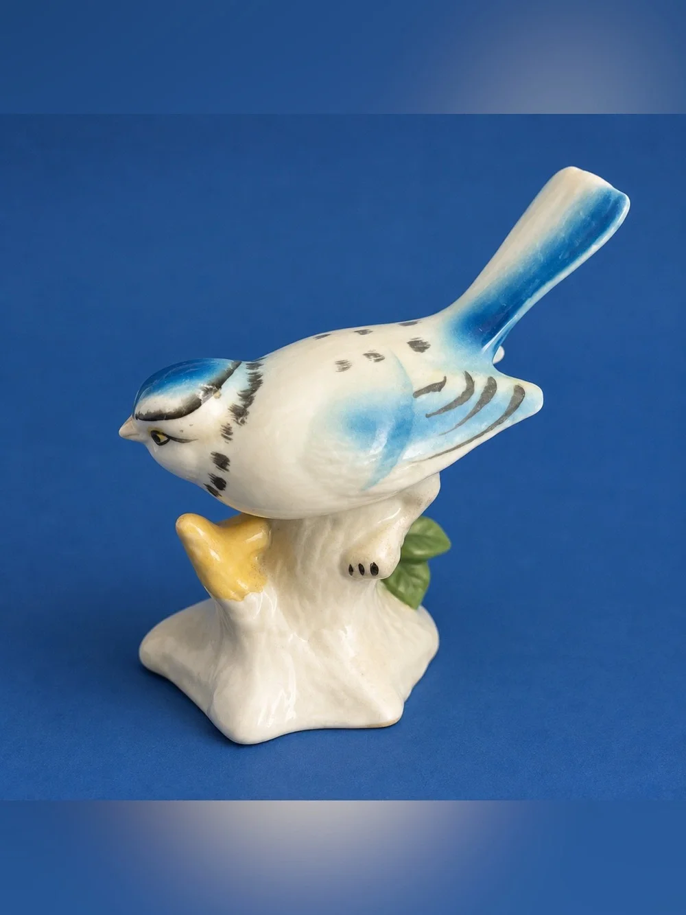 Vintage Hand-Painted Blue Bird Porcelain Figurine on Tree Stump – Songbird